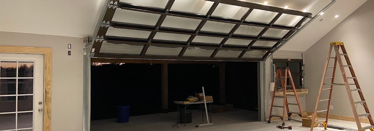 R&Y technician performing a garage door inspection and maintenance check in Taylor, TX